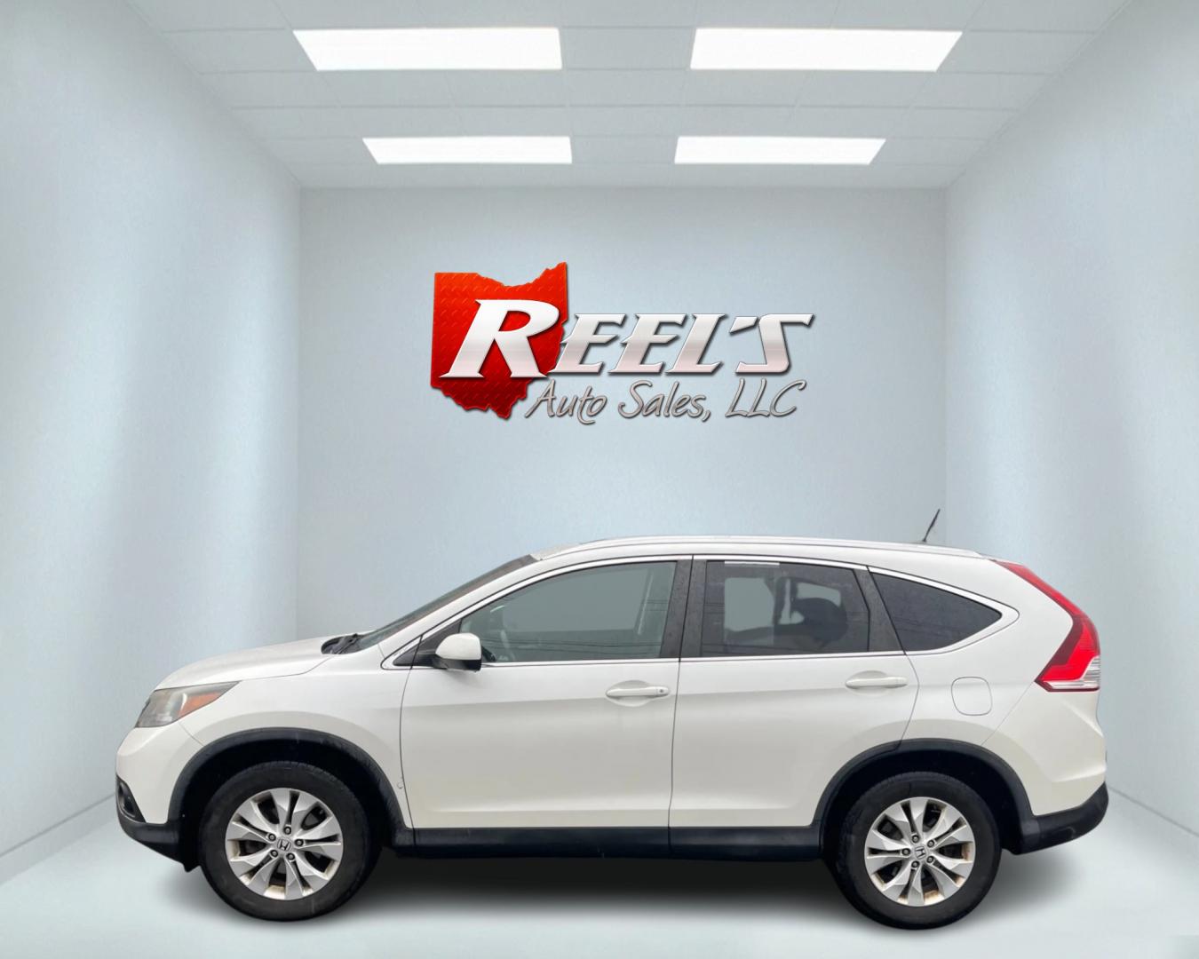 2013 White /Black Honda CR-V EX-L 4WD 5-Speed AT (5J6RM4H71DL) with an 2.4L I4 DOHC 16V engine, 5-Speed Automatic transmission, located at 11115 Chardon Rd. , Chardon, OH, 44024, (440) 214-9705, 41.580246, -81.241943 - This 2013 Honda CR-V EX-L AWD boasts a reliable 2.4L engine paired with a 5-speed automatic transmission, catering to drivers seeking both efficiency and all-wheel-drive capability. Its single-owner status may reassure potential buyers about its maintenance history. Luxurious features such as a leat - Photo#12